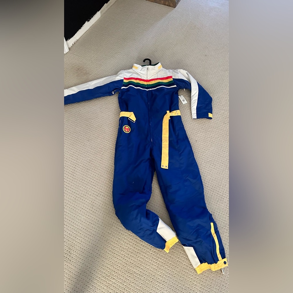 NWT:  NEVER WORN.  Our Mile-High ski suit is one for the record books!